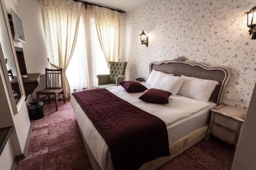 Tempat tidur dalam kamar di Raymar Hotels Ankara
