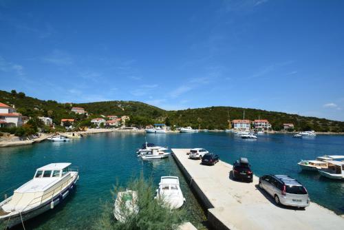 a group of boats docked in a harbor at Apartments by the sea Zaglav, Dugi otok - 12504 in Sali