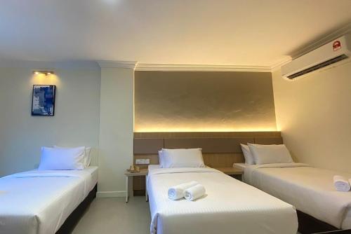 Katil atau katil-katil dalam bilik di SWISS AVENUE HOTEL