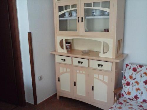 a wooden hutch in a corner of a room at Apartments with parking space Cres - 12609 in Cres