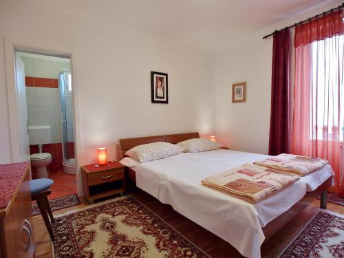 Apartments and rooms by the sea Rab - 12616