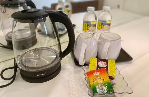 Kemudahan buat kopi dan teh di SWISS AVENUE HOTEL