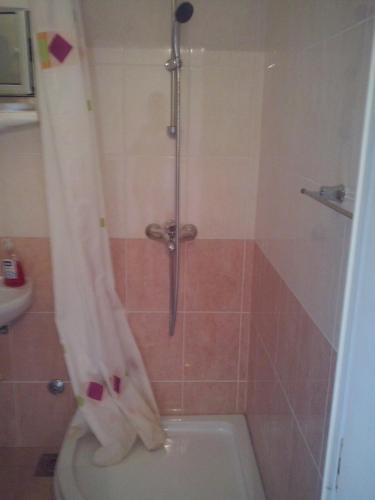 a bathroom with a shower with a toilet and a sink at Apartments by the sea Sumartin, Brac - 11658 in Sumartin