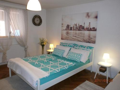 a bedroom with a bed with blue and white at Apartments with a parking space Samobor, Prigorje - 12869 in Samobor