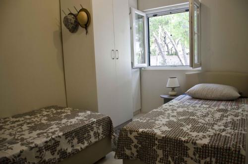 Postel nebo postele na pokoji v ubytování Seaside house with a swimming pool Hvar - 12919