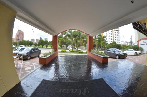 a view of a parking lot with cars parked at Hotel Pinares Plaza in Pereira