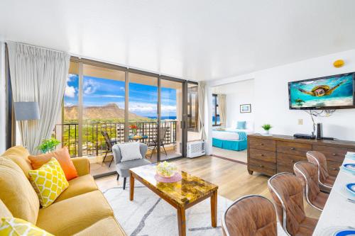 a living room with a couch and a table at Beautiful Ocean and Diamond Head Views with Parking in Honolulu
