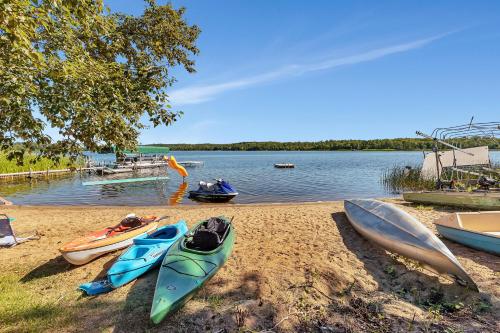 a group of kayaks on the shore of a lake at Blue Moon Resort & Motel in Hill City