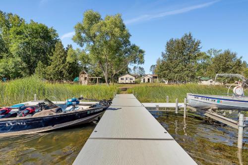 two boats are docked at a dock in the water at Blue Moon Resort & Motel in Hill City