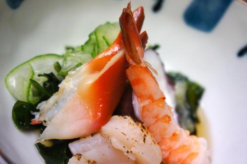 a plate of food with shrimp and vegetables at Hotel Pfauen in Umkirch