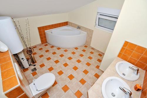 a bathroom with a toilet and a sink at Holiday house with a parking space Zadar - 14848 in Zadar