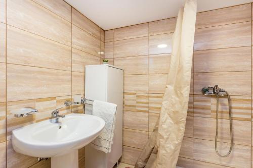 a bathroom with a sink and a shower at Holiday house with a parking space Risika, Krk - 14860 in Vrbnik