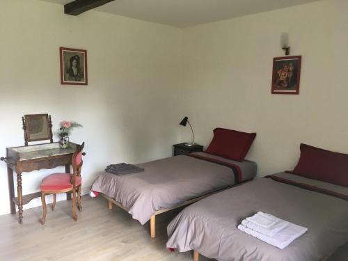Posteľ alebo postele v izbe v ubytovaní Le Clos Crista Galli