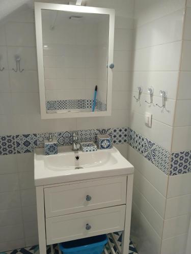 a bathroom with a white sink and a mirror at ANGELS HOUSE in Skala Kallirakhis