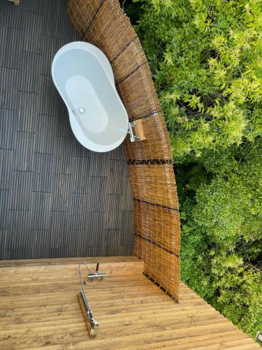 an overhead view of a toilet on a wooden deck at Alaise De Bale Shirahama in Shirahama
