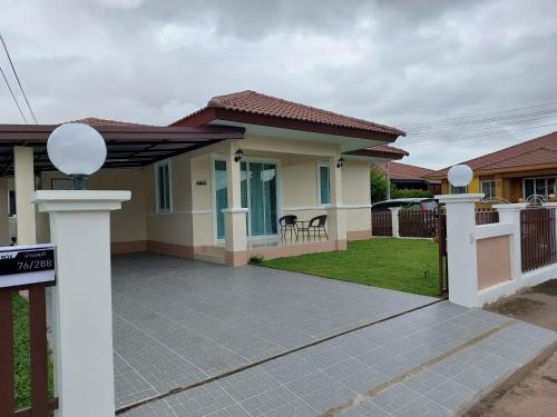 a house with a gate and a driveway at HAPPY SPACE Villa 2นอน 2น้ำ in Nakhon Phanom
