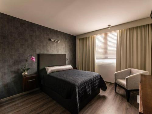 Postel nebo postele na pokoji v ubytování Suites Meson Del Cid