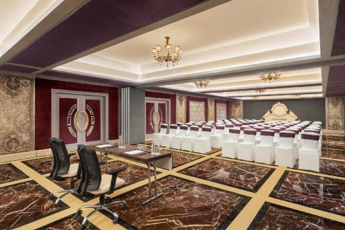 a conference room with a rows of chairs in it at Hotel Hillock Ahmedabad in Ahmedabad