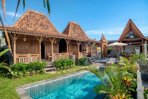 an image of a villa with a swimming pool at PNB Bali Villas in Canggu