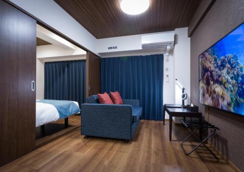 TV a/nebo společenská místnost v ubytování Ryujin Hotel Ukishima