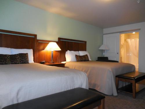 Tempat tidur dalam kamar di Aspen Suites Hotel Anchorage