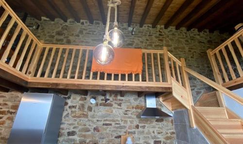 an overhead view of a room with wooden stairs at Tiñones cabaña pasiega in Valcaba