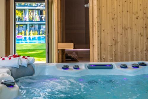 a jacuzzi tub in a room with at H55 in Balatonlelle