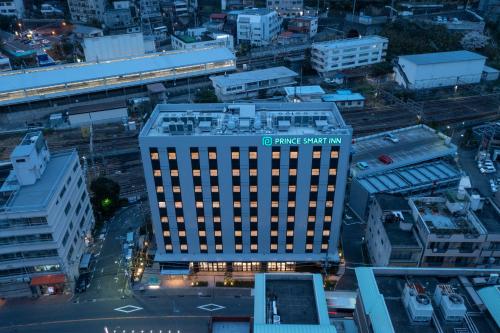 una vista aérea de un edificio con un cartel en él en Prince Smart Inn Atami, en Atami