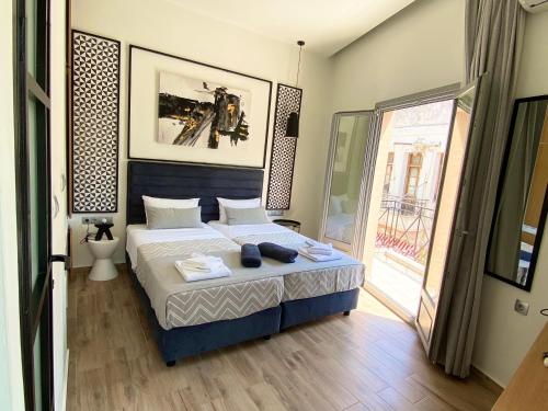 Ένα ή περισσότερα κρεβάτια σε δωμάτιο στο Residenza Rithymna Centro