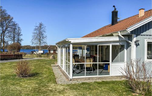 an extension to a conservatory on a house at Nice Home In Ljungby With Wifi in Ljungby