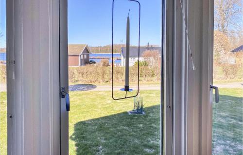 an open window with a view of a yard at Nice Home In Ljungby With Wifi in Ljungby