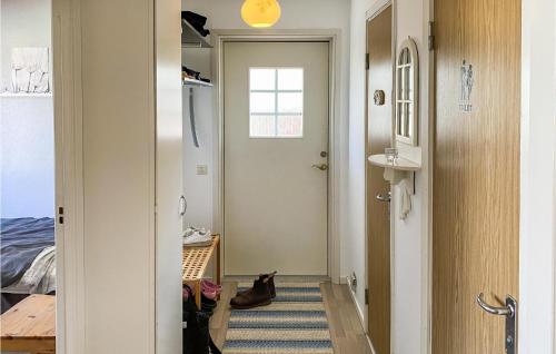 a hallway with a door leading to a bedroom at Nice Home In Ljungby With Wifi in Ljungby