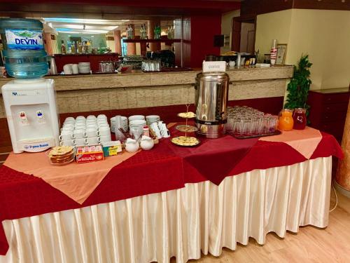 a table with a red and white table cloth at Sveta Sofia Hotel in Sofia