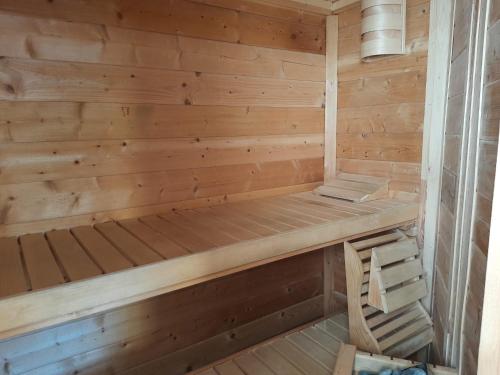 a wooden sauna with a wooden bench in it at Haus Rauschenbach in Rauschenbach