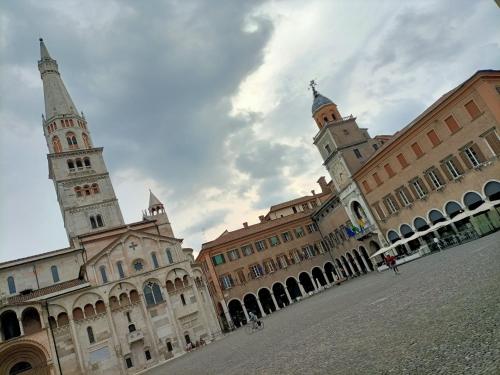 a group of buildings with two towers at Il Gioiellino di Modena - Elegant Apartment[☆☆☆☆☆] in Modena