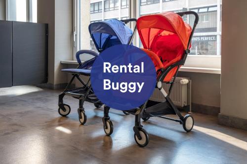 two strollers in an office with the words rental buggy at a&o Berlin Friedrichshain in Berlin