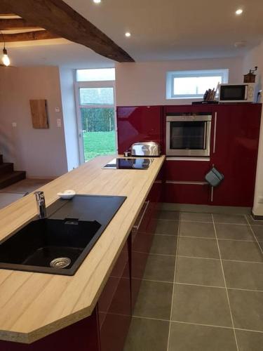 a kitchen with a sink and a counter top at La grange de Victor 12/14 pers - Mont-Saint-Michel in Céaux