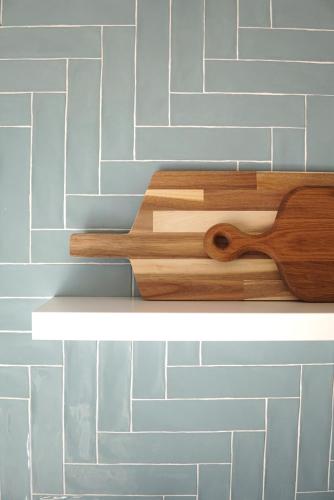 two pieces of wood on a shelf on a wall at A Casa de Cima - Cacela Velha in Vila Nova De Cacela