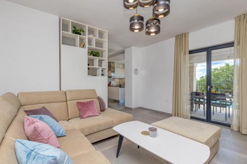 a living room with a couch and a table at Villa Istria Vabriga in Vabriga