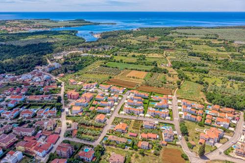 an aerial view of a city with houses and the ocean at Villa Istria Vabriga in Vabriga