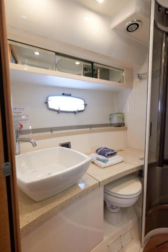 a bathroom with a sink and a toilet at Marli II in Lymington