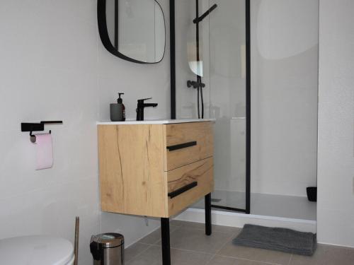 a bathroom with a sink and a mirror at Chalet Pralognan-la-Vanoise, 4 pièces, 8 personnes - FR-1-464-188 in Pralognan-la-Vanoise