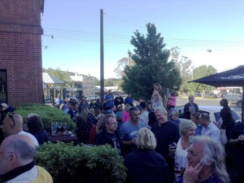 a crowd of people standing outside of a building at Holgate Brewhouse in Woodend
