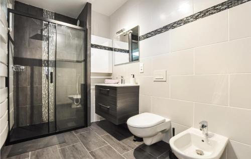 a bathroom with a shower and a toilet and a sink at Amazing Apartment In Cannes With Wifi in Cannes