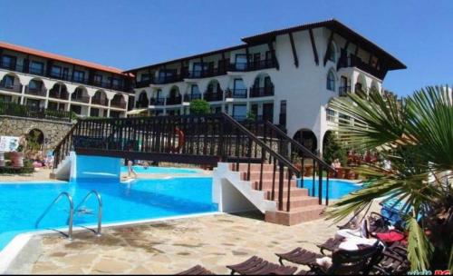 a resort with a swimming pool and a building at Marina Dinevi Complex Monastery 1 Saint Vlas in Sveti Vlas