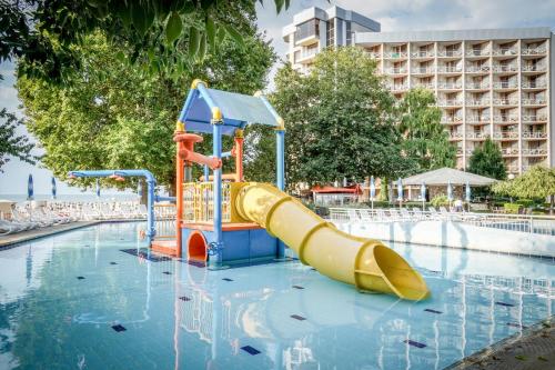 a water park with a slide in the water at Kaliakra Beach Hotel - Ultra All Inclusive in Albena