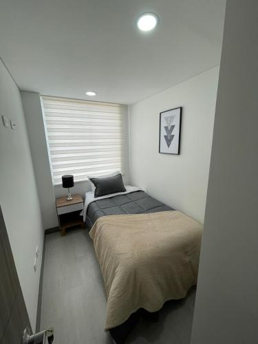 Ένα ή περισσότερα κρεβάτια σε δωμάτιο στο Magnifico y Confortable Apartamento Amoblado
