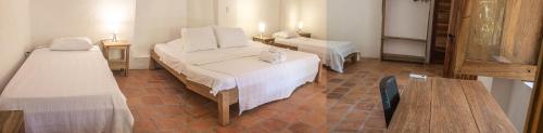 Ένα ή περισσότερα κρεβάτια σε δωμάτιο στο Casa Taller & Hotel El Boga