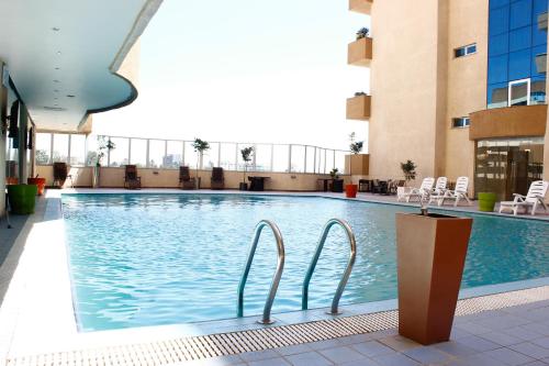 a swimming pool in the middle of a building at Elilly International Hotel in Addis Ababa