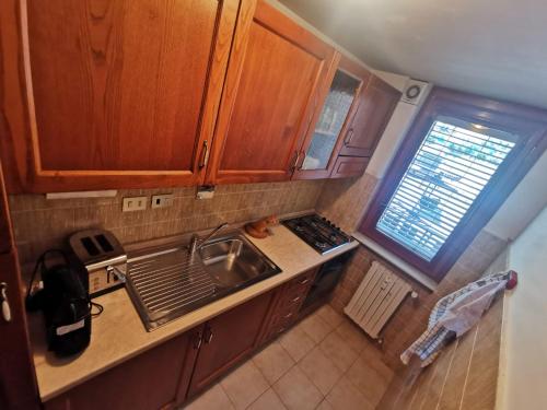 an overhead view of a kitchen with a sink at Homey Apartment in the heart of Cervinia in Breuil-Cervinia